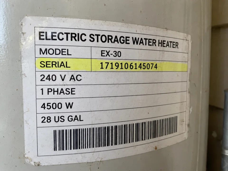 Illustrative electric water-heater label with serial 1719106145074 highlighted